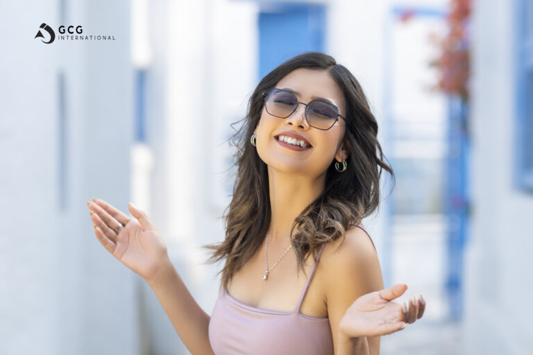 A girl happily standing with GCG Eyewear.